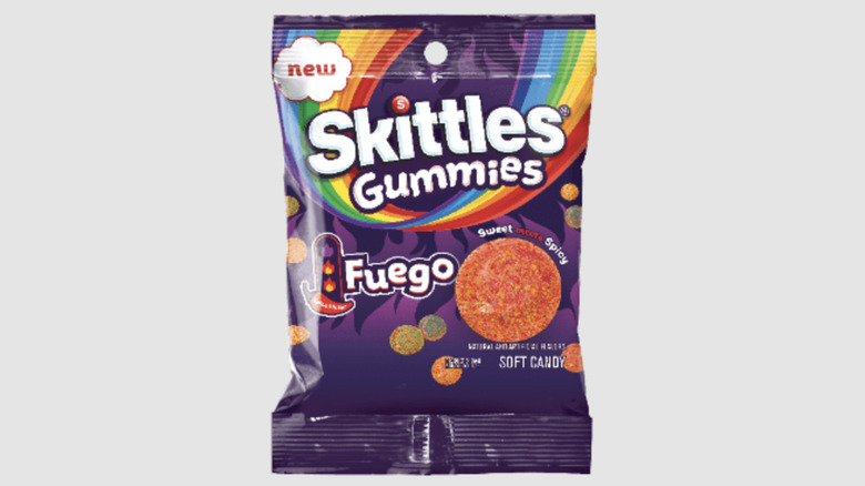 bag of Skittles Gummies Fuego on a gray background