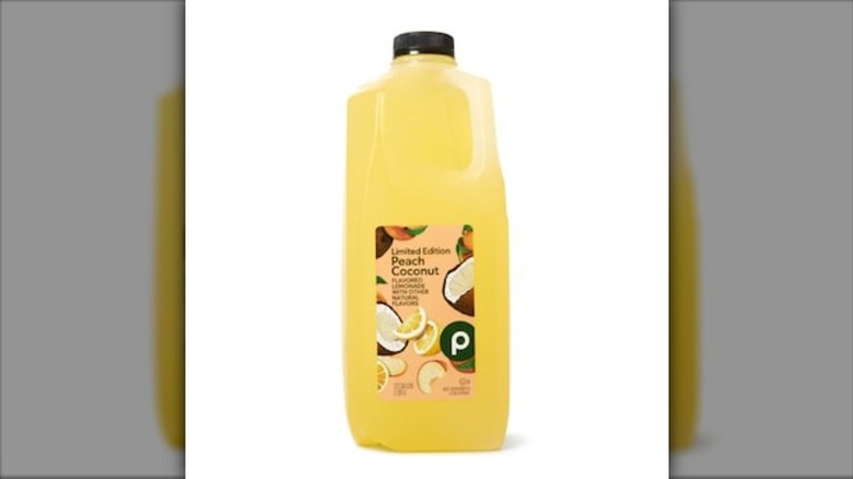 A jug of Publix Peach Coconut Lemonade, on a white background.