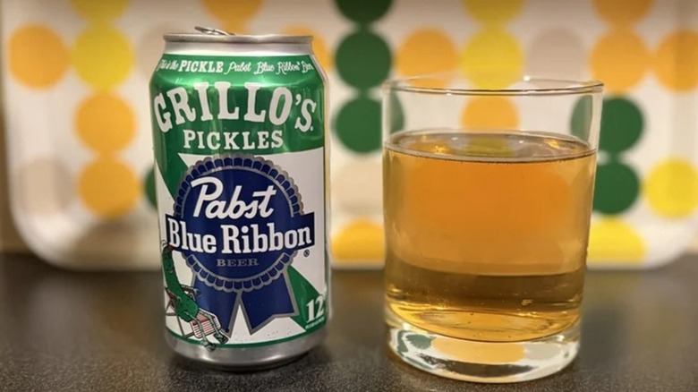 Can of Grillo's Pickles Pabst Blue Ribbon poured in a glass