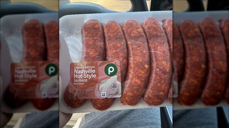 Person holding a pack of Publix sausage