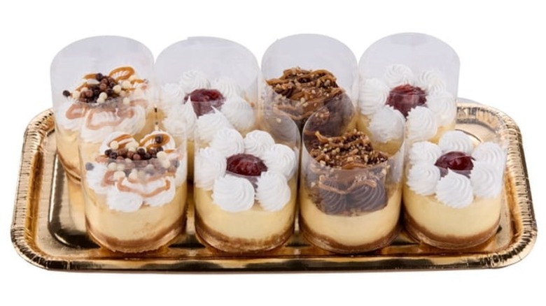 Member's Mark Three-Inch Assorted Cheesecakes on a foil tray on a white background.
