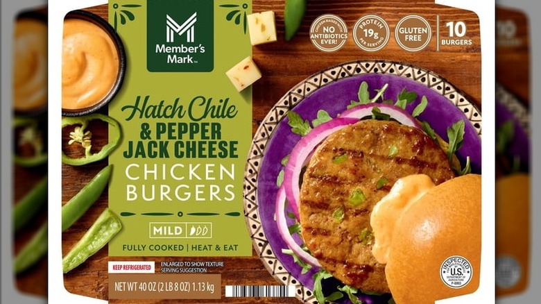 A package of Member's Mark Hatch Chile and Pepper Jack Cheese Chicken Burgers on a white background.