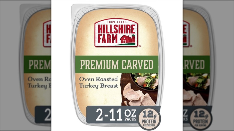 Plastic container of Hillshire Farm Oven Roasted Turkey Breast.