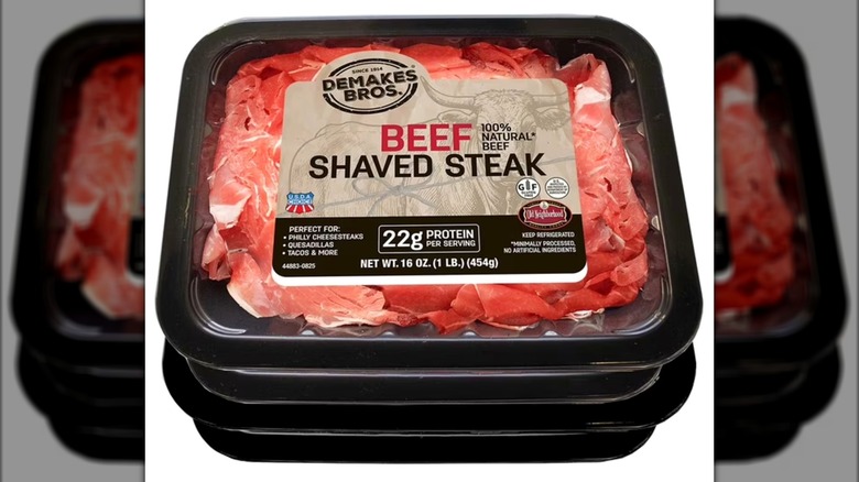 Two packs of Demakes Bros. Choice Beef Shaved Steak stacked on white background