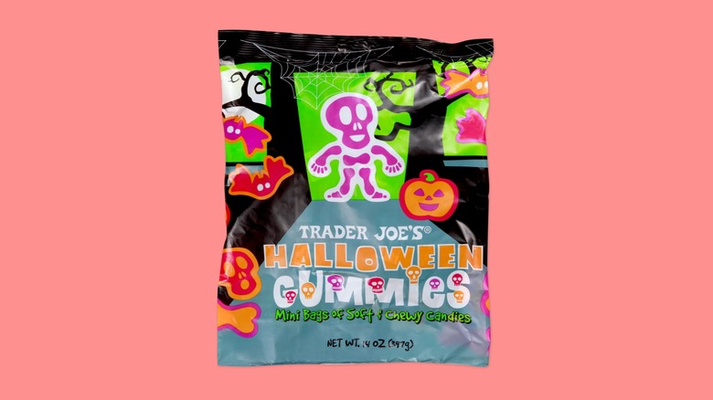 A bag of the Halloween Gummies from Trader Joe's on a pink background.