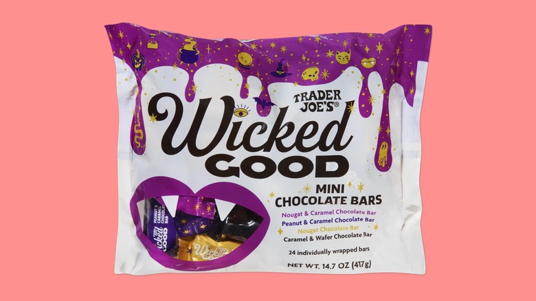 A bag of the Wicked Good Mini Chocolate Bars from Trader Joe's on a pink background.