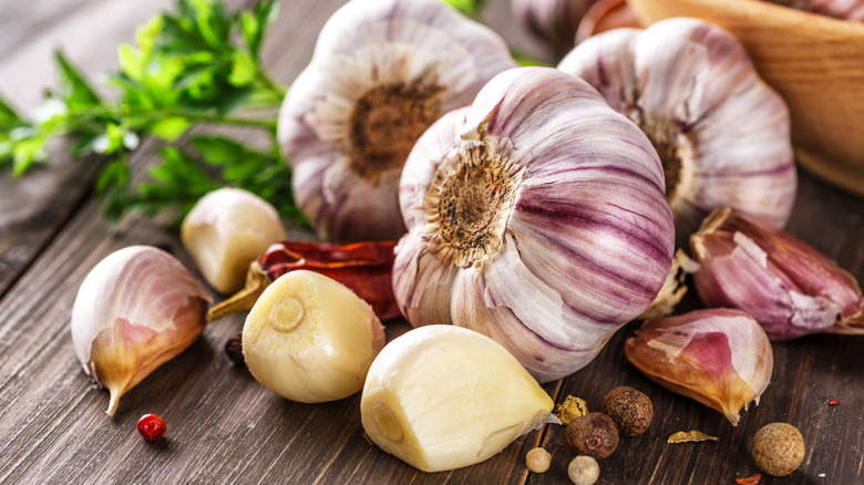 Close-up view of bulbs of garlic on a wooden table
