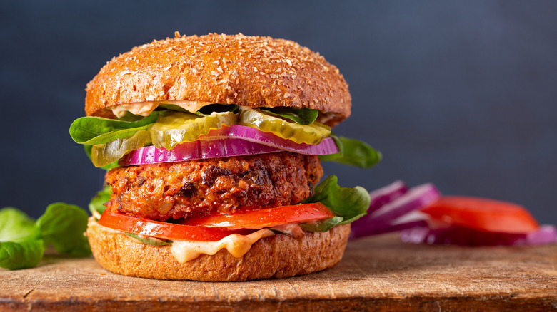 Vegan burger with assorted toppings in a bun
