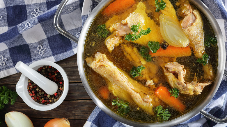 stockpot filled with ingredients for chicken stock