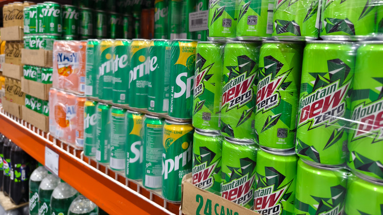 A grocery store display showing cases of Mountain Dew Zero and other brands