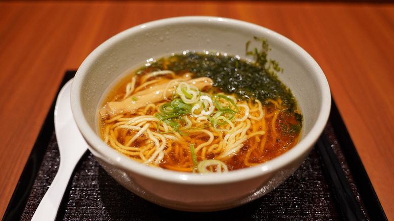 Bowl of noodle soup made with light soy sauce broth