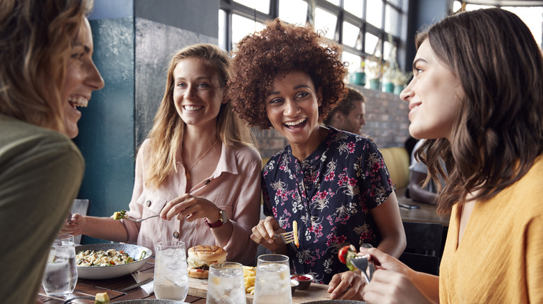 Four young women at a restaurant.