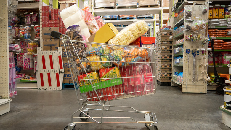 A shopping cart full of junk food