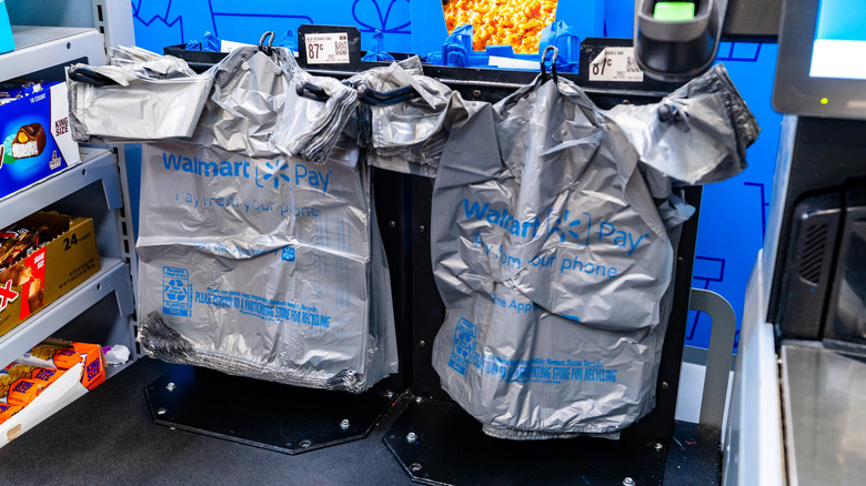Walmart plastic bags at a self-checkout area inside the store