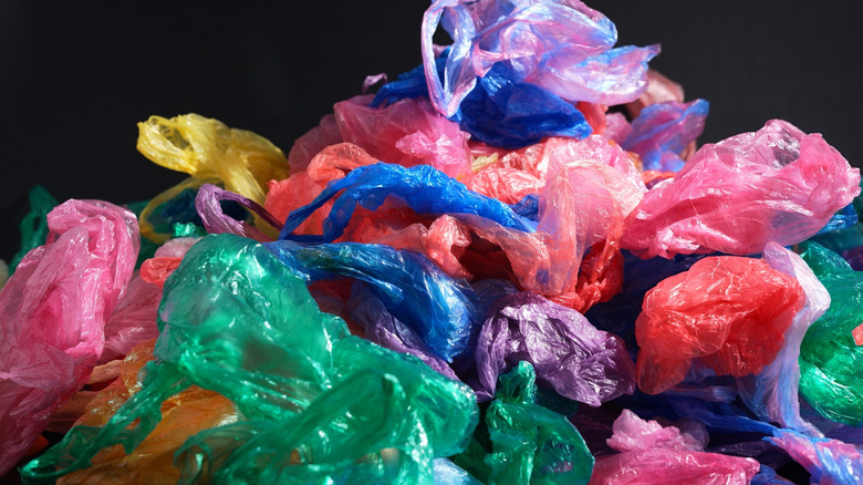 A collection of multi-colored single-use plastic bags