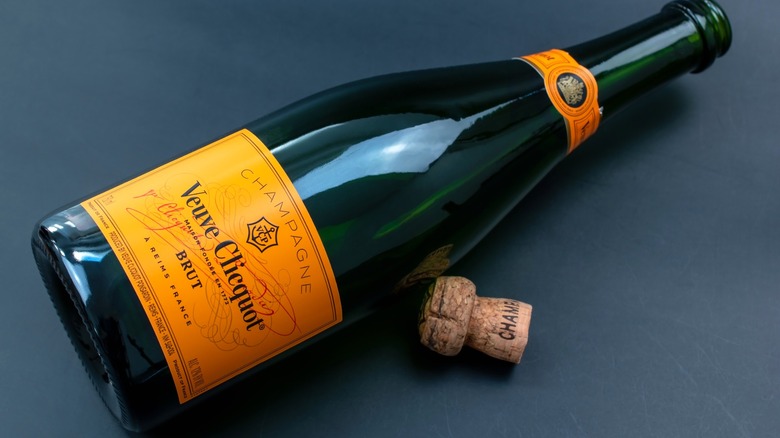 Veuve Clicquot champagne bottle on its side with cork out