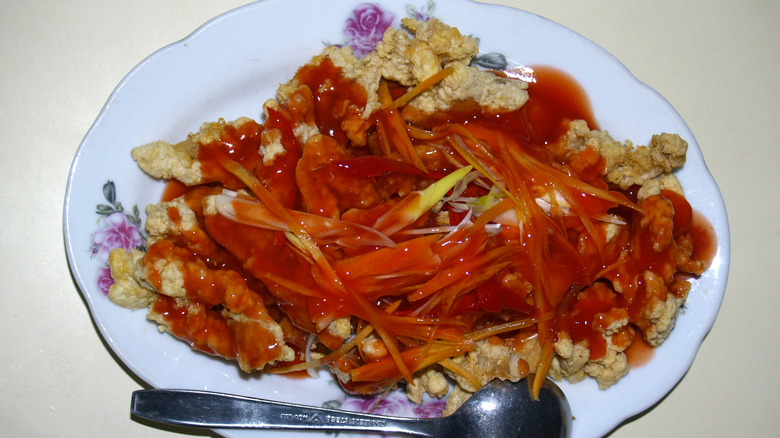 Fried python on dish with sauce