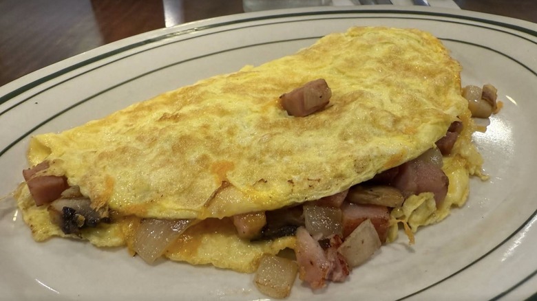 Ham and onion omelet from The Pancake Shop on an oval white platter