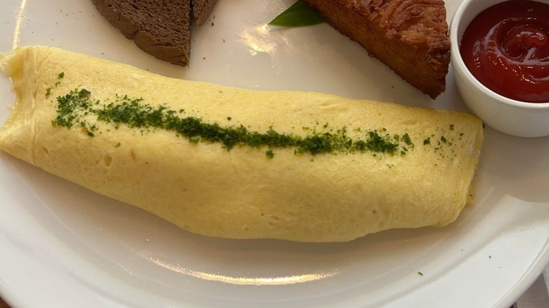 French Omelette from Koko Head Café on a white plate
