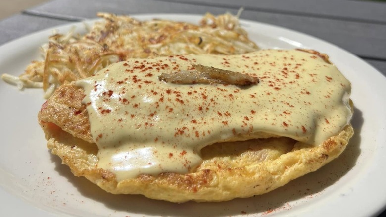 Popeye Omelet with hash browns at The Bluebird Cafe on a white plate
