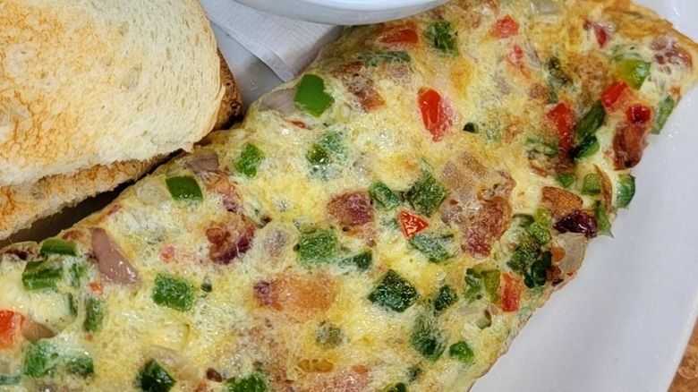 Southwest Omelet with side of toast from The Roost on a white plate