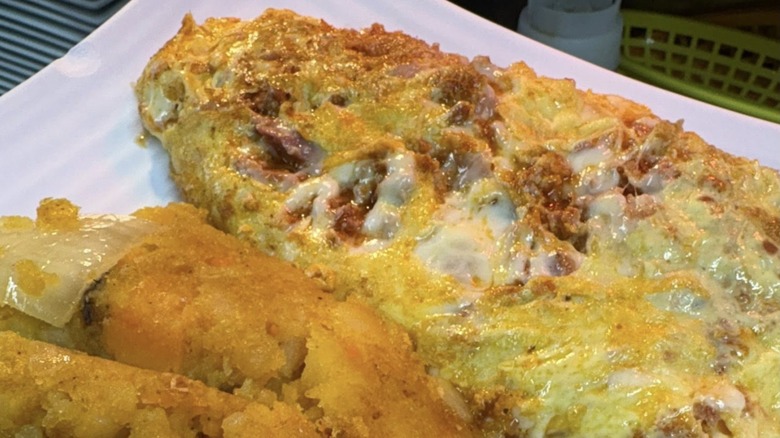 Omelet with potatoes from Neighborhood Restaurant & Bakery on a white plate
