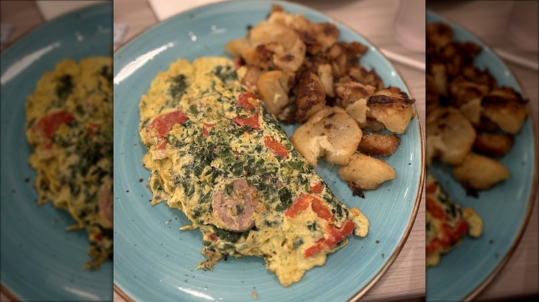 Tuscan omelette with country potatoes at Amy's Omelette House on a blue plate