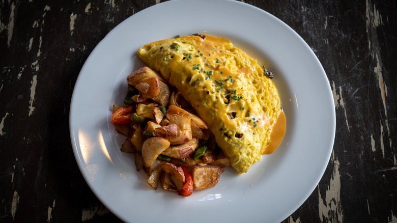 Plant-based omelet with potatoes from The Wayward Cafe on a white plate