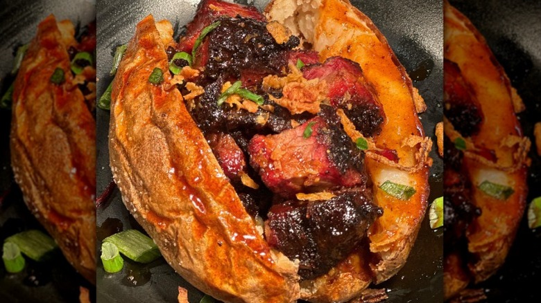 baked potato filled with burnt ends and BBQ butter