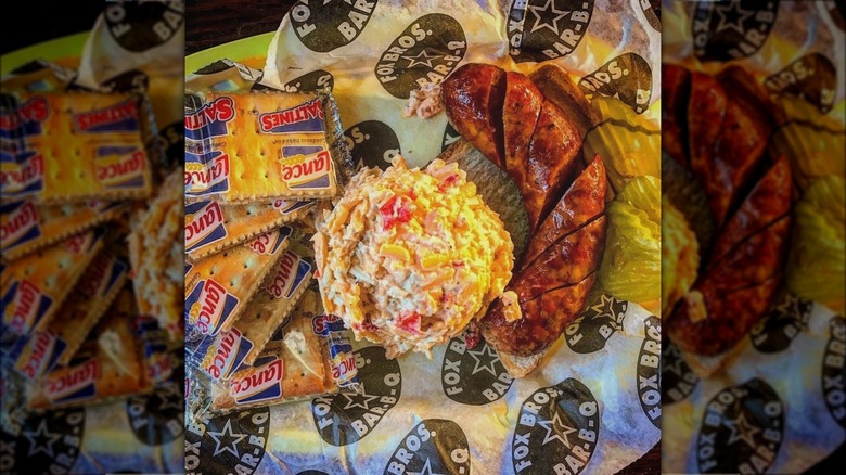 Smoked sausage with sides on tray