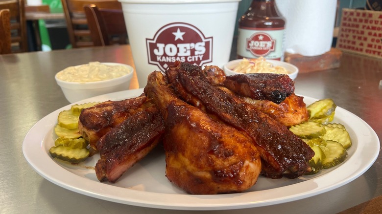 Glazed barbecue chicken and ribs on plate