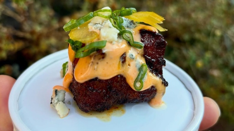 Burnt end with cheese sauce