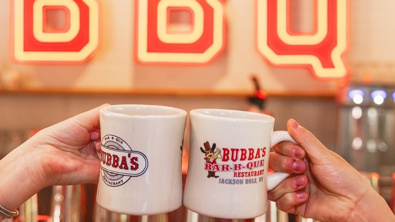 hands clinking Bubba's mugs