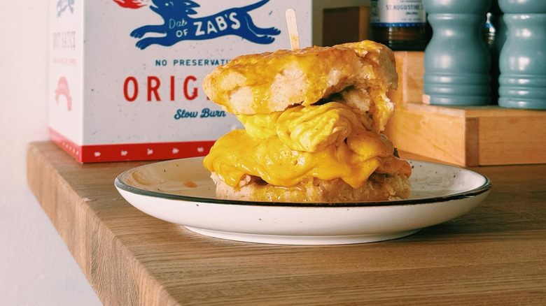 Breakfast sandwich and hot sauce