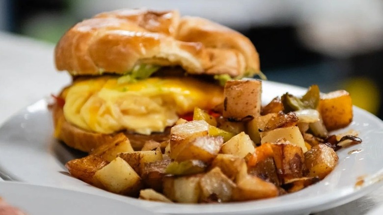 Breakfast sandwich with breakfast potatoes from The French Press