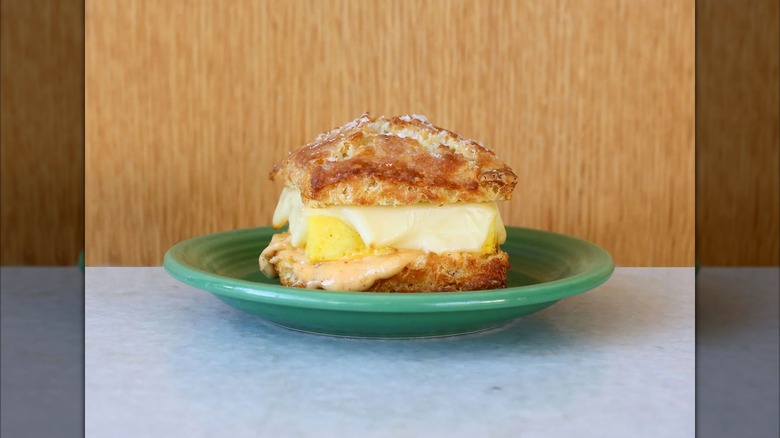 Tandem biscuit sandwich in front of brown background