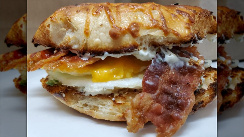 A beautiful bagel sandwich with egg and bacon