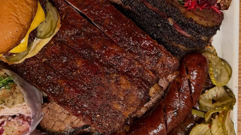 Moo's Craft Barbecue Brisket plated up with other bbq sides