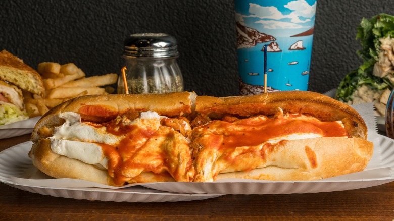 Chicken Parmesan sandwich on paper plate