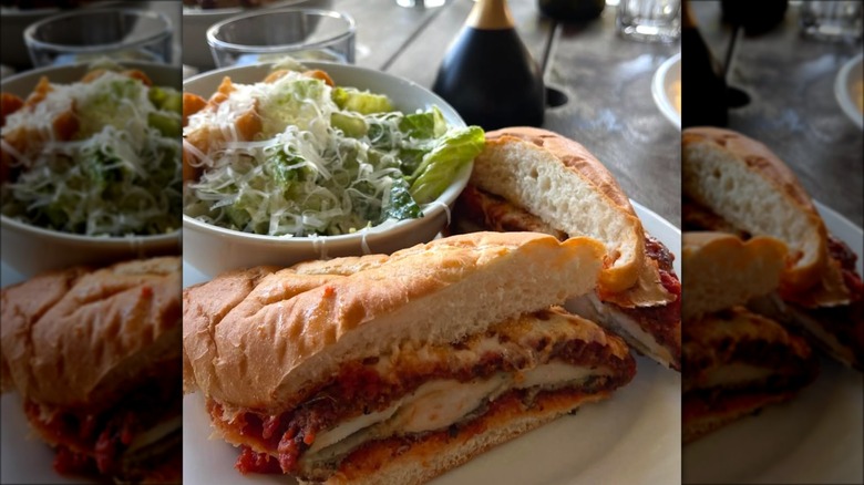 Chicken Parmesan sandwich with Caesar salad