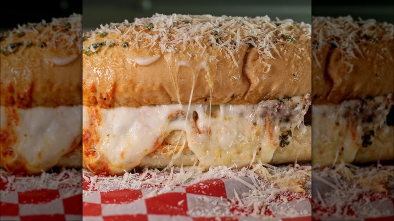 Chicken Parmesan sandwich with melted and grated cheese