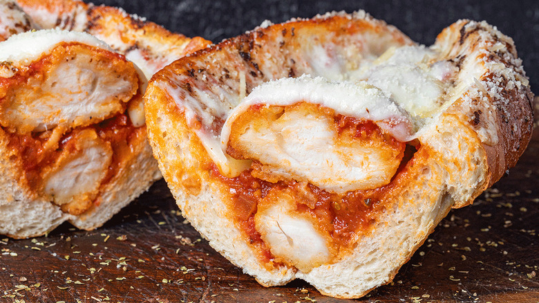 Two halves of chicken Parmesan sandwich