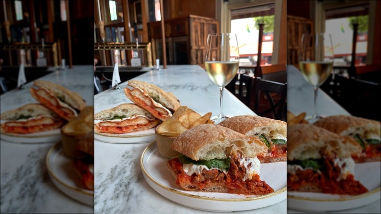 Chicken Parmesan sub and meatball Parmesan sub on plates