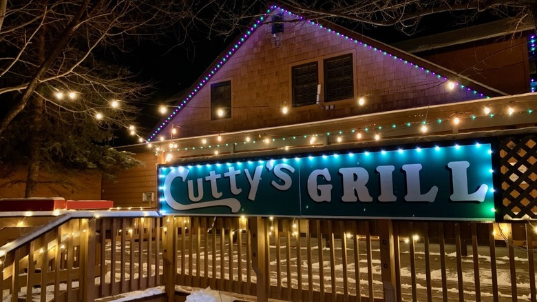 Cutty's Bar & Grill exterior lit up at night
