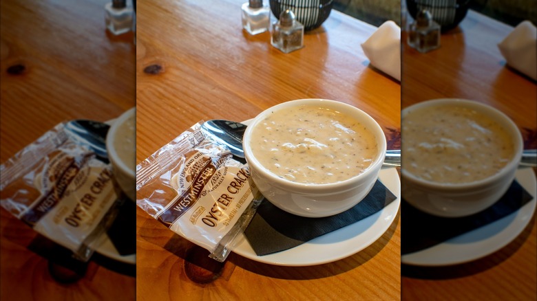 Mug of The Mariner clam chowder with a side packet of crackers