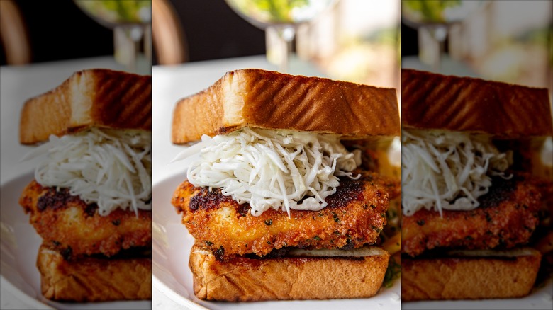 C&S Oyster Bar Nashville Hot Crispy Fish sandwich on a white plate