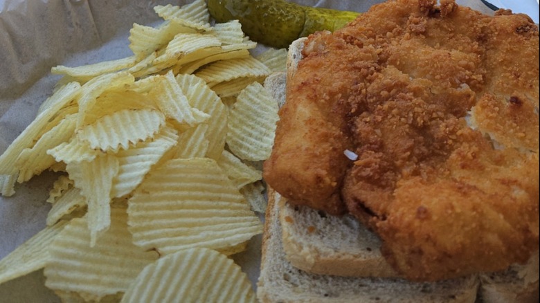 Cunningham's Creekside Fish Sandwich with chips and a pickle