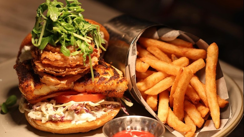 Blind Rabbit Kitchen Market Fish Sandwich with a side of fries and ketchup