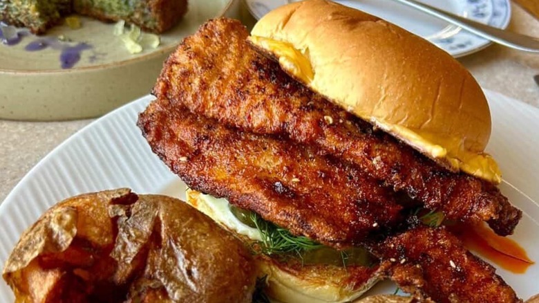 The Wolf and Uncle Wolfie's Downtown Chili Crisp Fishwich on a white plate