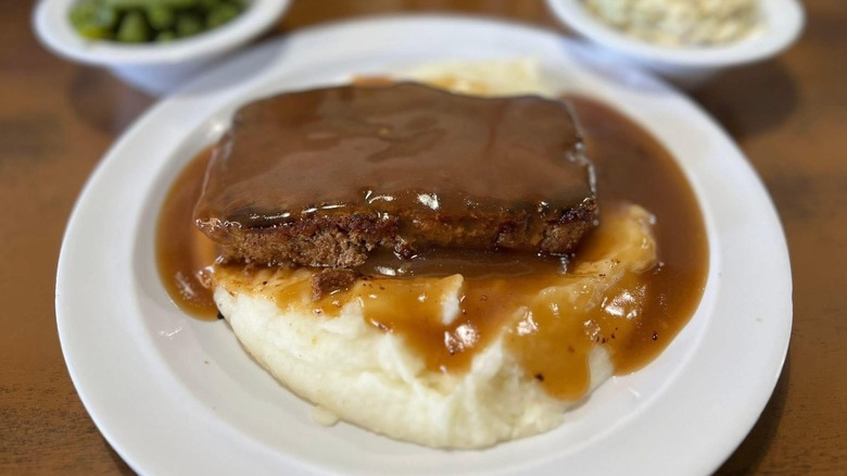 Zingo's Cafe Meatloaf with Brown Gravy on top of mashed potatoes